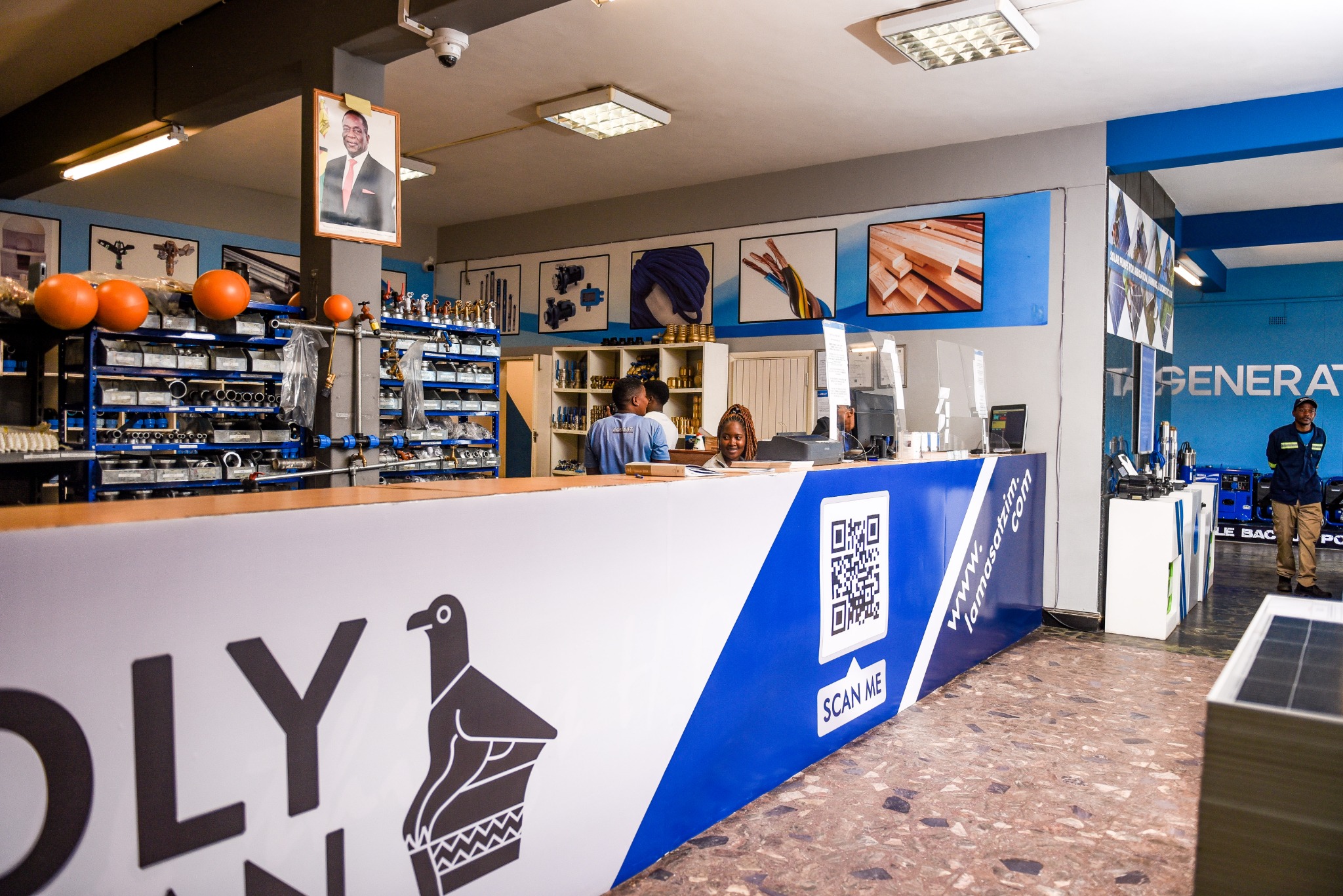 Lamasat shop counter with staff and plumbing products on display